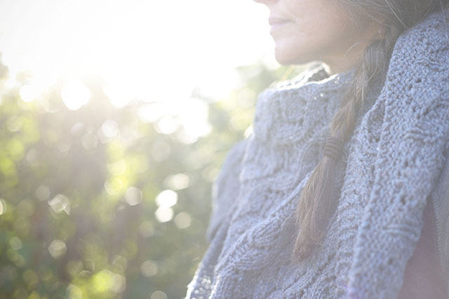 Image of me wearing Sylvia McFaddin's With Ease shawl in the afternoon sun.