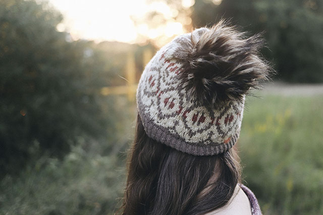 Image of my Cardamom Coffee Hat by Caitlin Hunter with a giant fluffy pompom.