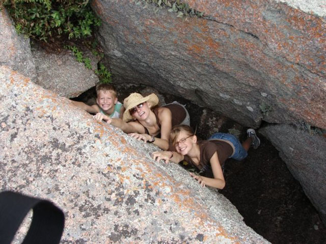 Image of my family pretending to be trapped in a slot canyon.