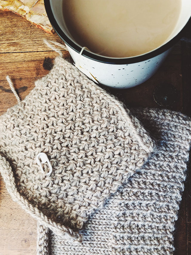 Image of my Kapsel test knit swatches next to a cup of tea.