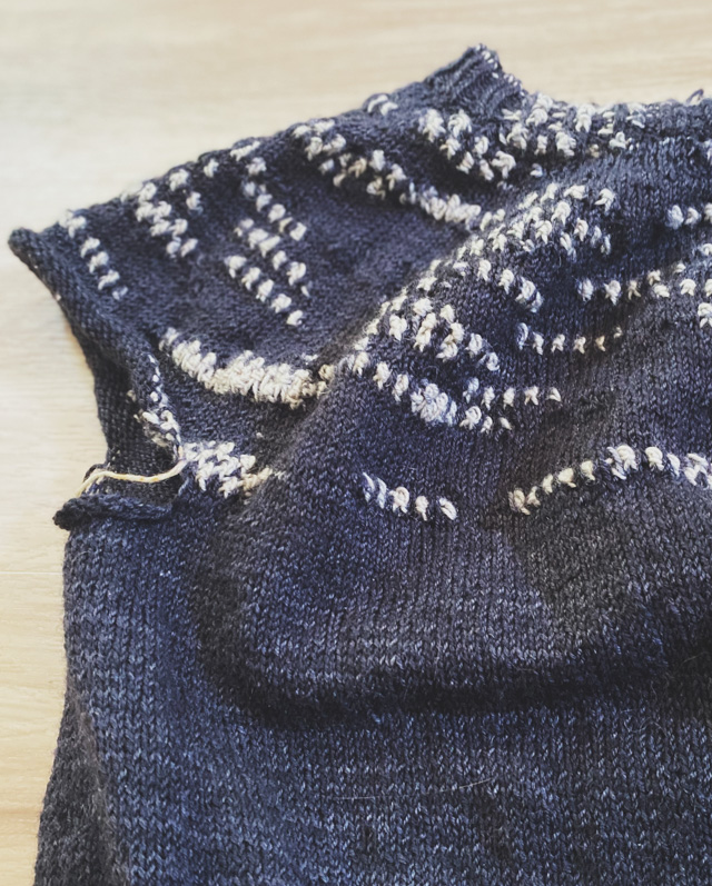 Image of my Murder of Crows sweater in progress: a textured assigned pooling yoke sweater.