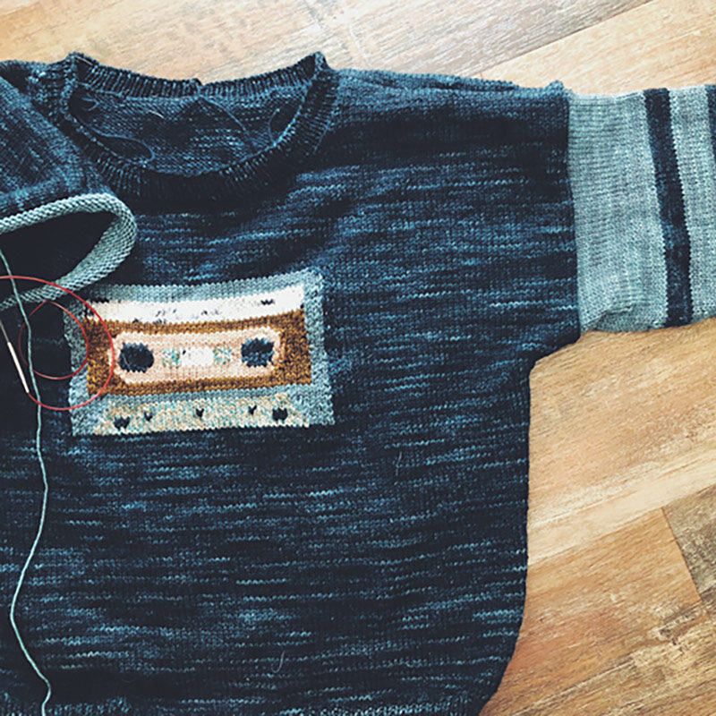 Image of a hand knit mix Tape sweater.