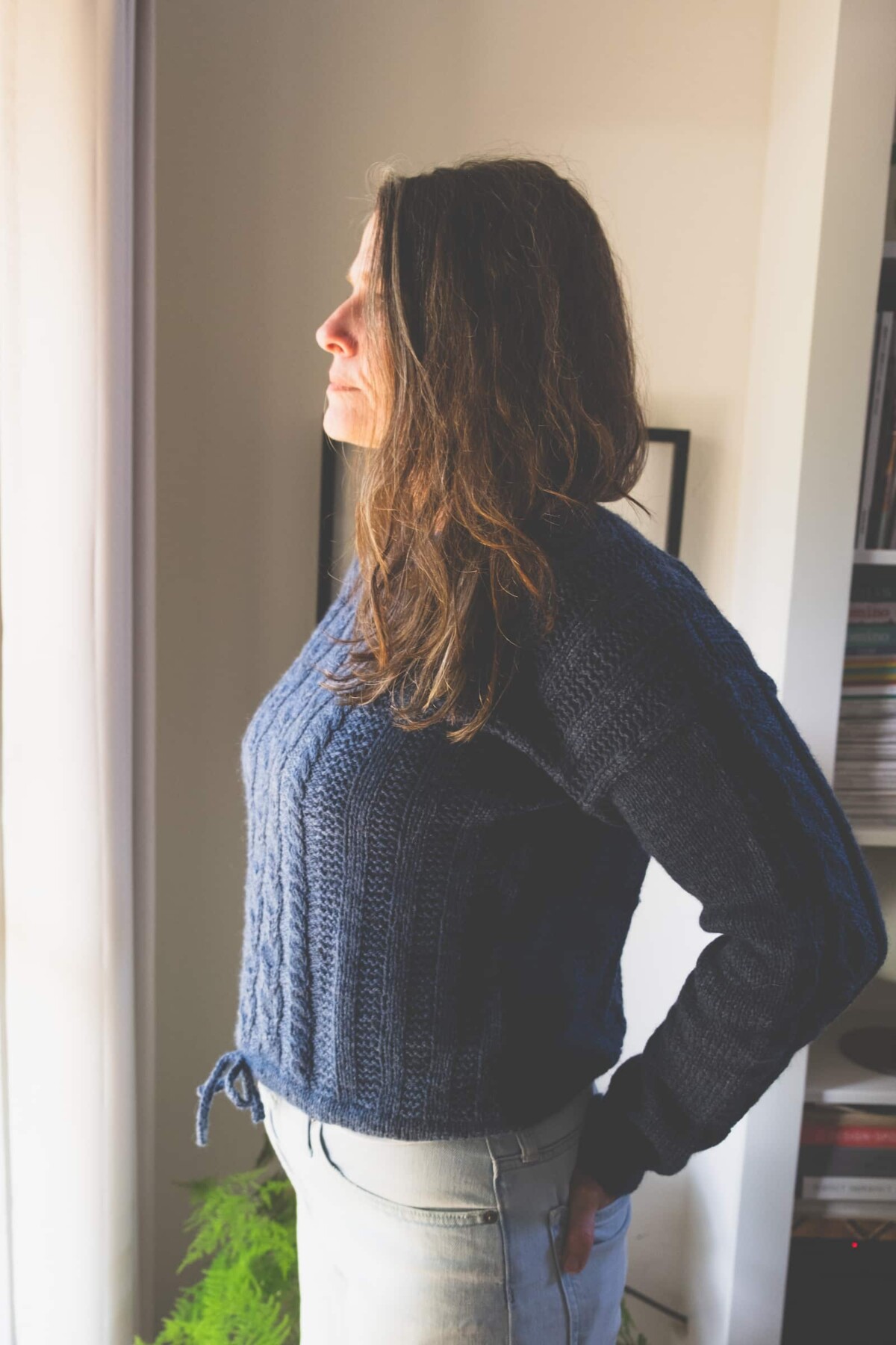 Image of my Lately Pullover that shows the high hip length where the edge its.