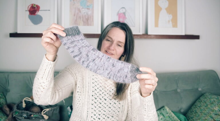 Image of me holding up what looks like the wierdest sock ever but is actually the easiest sock pattern ever.