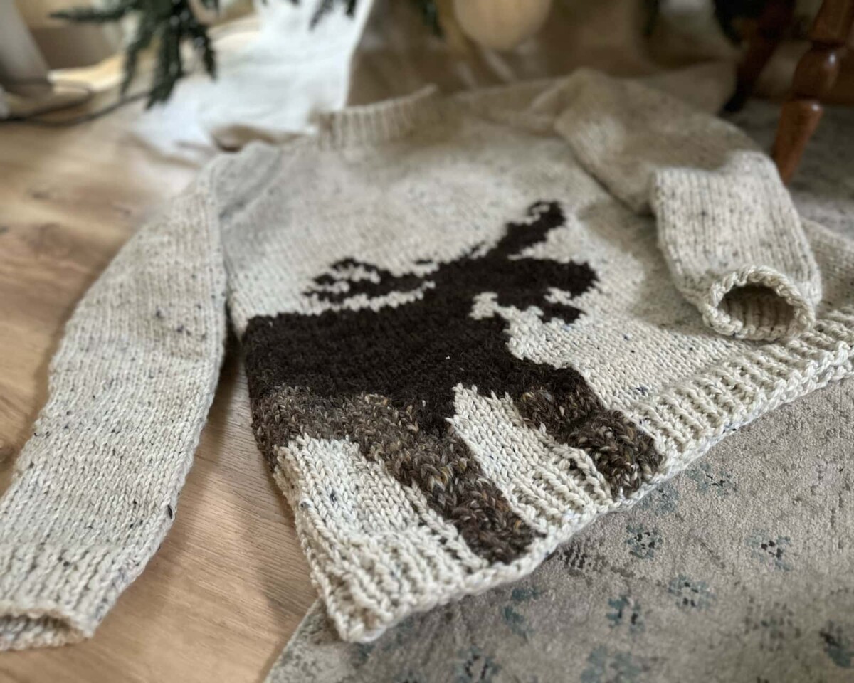 Image of my Ugly Moose sweater under the Christmas tree.
